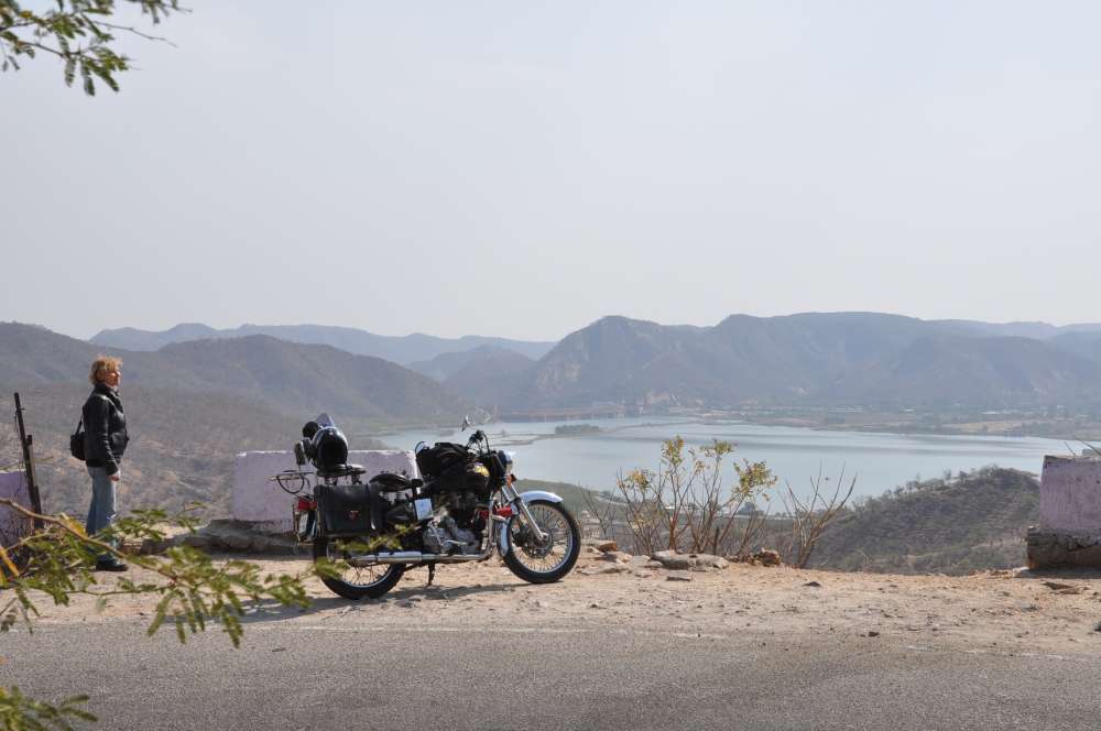 Bike at side with lake and hills at back