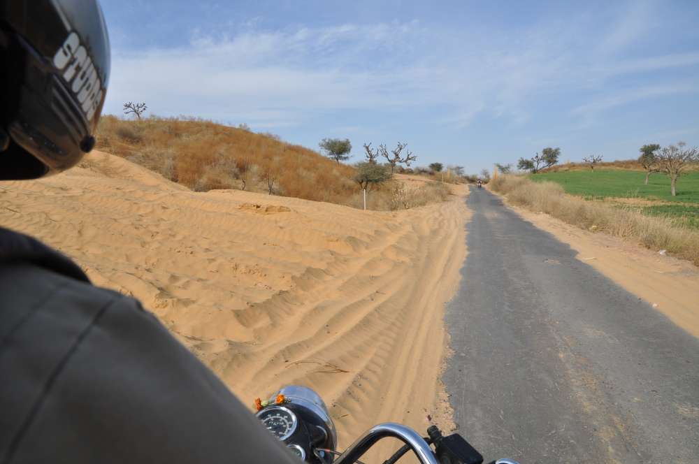 Riding Bike in the desert through road